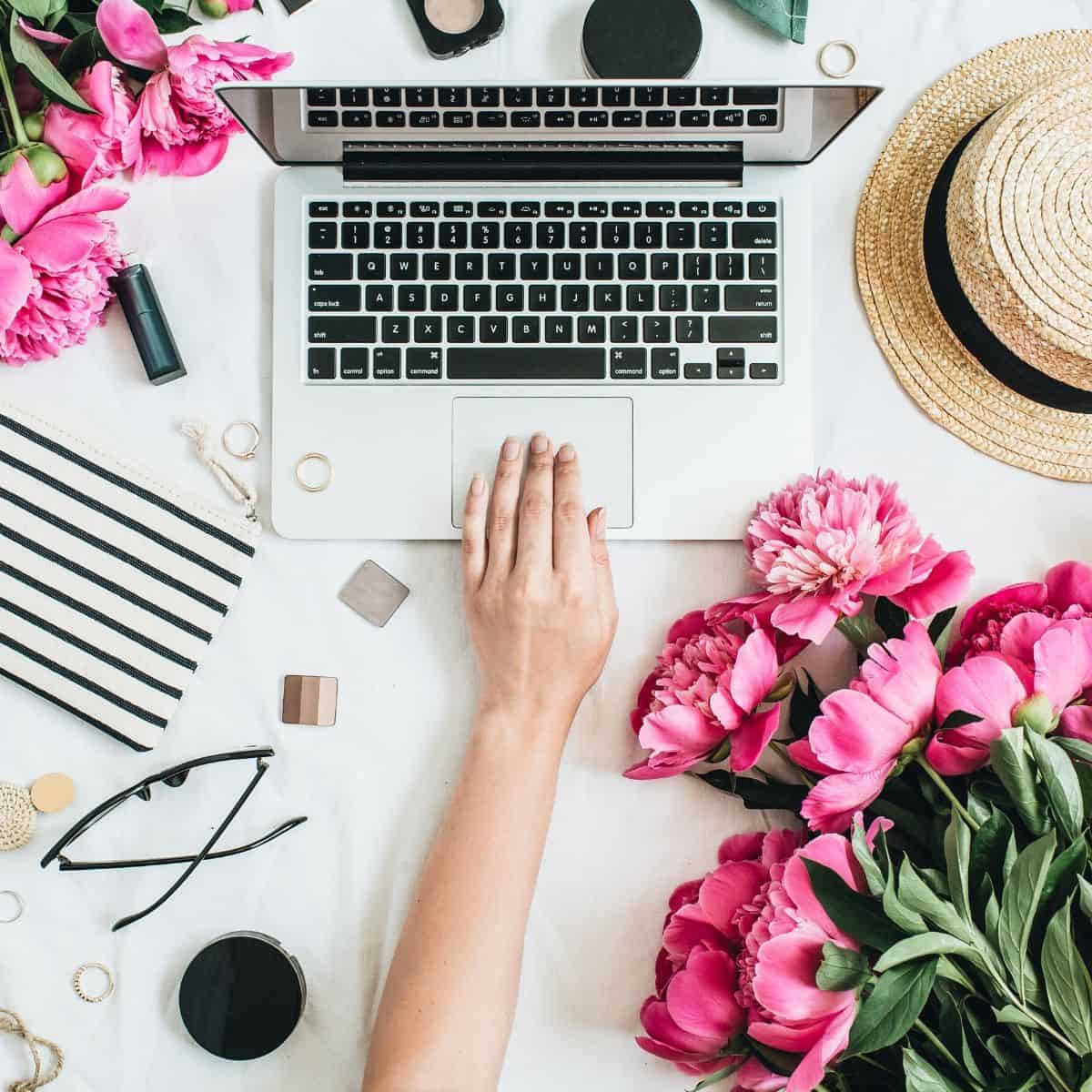 woman's hand at computer, blogging